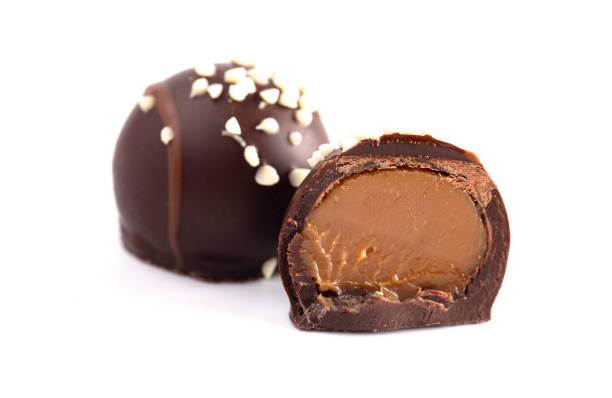 istock Salted Caramel Filled Dark Chocolate Truffles Isolated on a White Background 1162992177