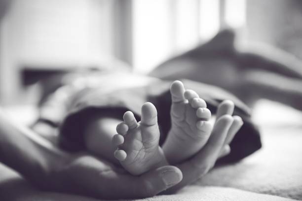 istock Little baby feet 1162992349