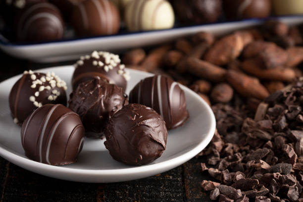 istock A Moody Image of Chocolate Truffles on a Rustic Wooden Table 1162992381