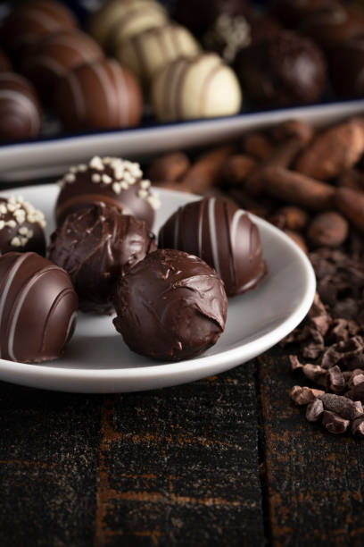 istock A Moody Image of Chocolate Truffles on a Rustic Wooden Table 1162992412