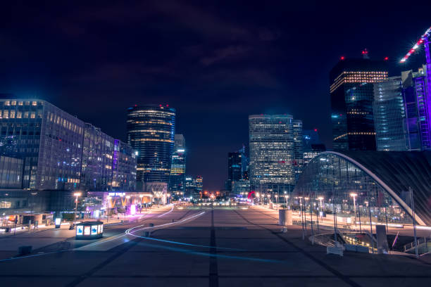 istock Pedestrian Square Surrounded by Night Skyscrapers 1162993647