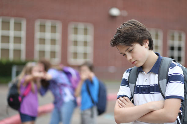 istock Pre-adolescent boy being bullied at school. 1162995457