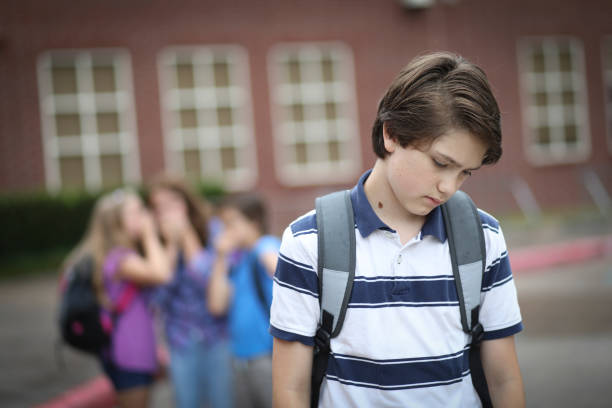 istock Pre-adolescent boy being bullied at school. 1162995464