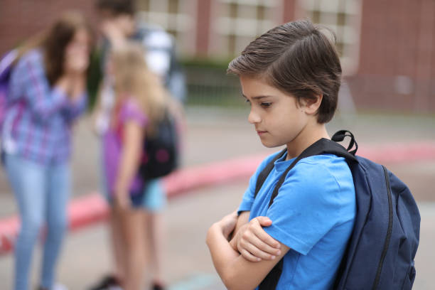 istock Elementary age boy being bullied at school. 1162995527