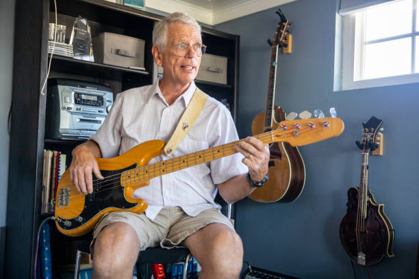 istock Senior Man Playing Bass in his Studio 1162998620