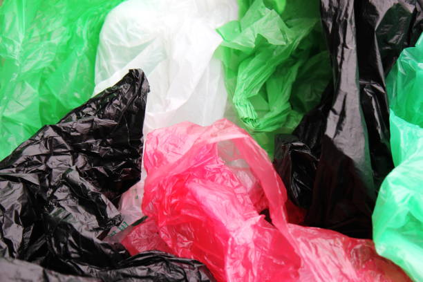 istock A bunch of reusable, multi-colored plastic bags polluting the environment. 1162999675