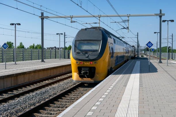 istock Train arriving at central station Lelystad, the Netherlands 1163000443