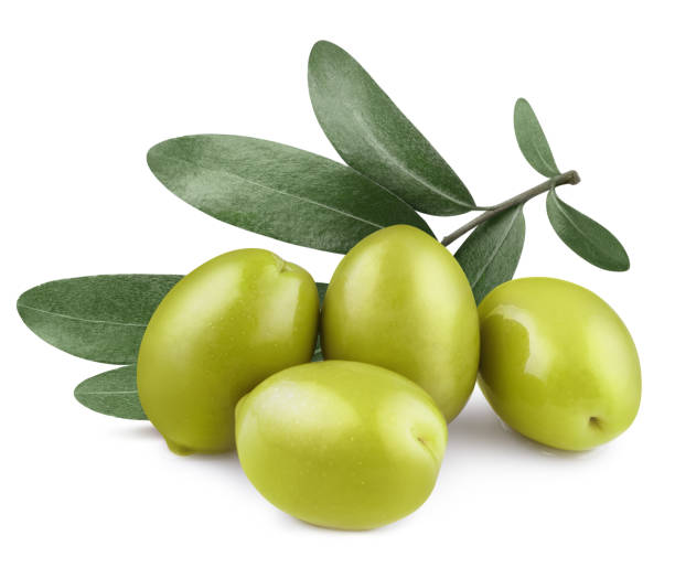 Olives on white Delicious green olives with leaves, isolated on white background green olive fruit stock pictures, royalty-free photos & images