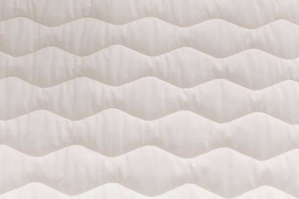 Close up mattress texture. Comfortable sleep concept. New modern mattress, for background.