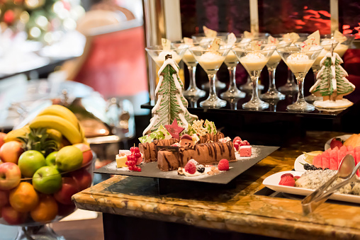 Cropped out photo of selection of desserts, selective focus