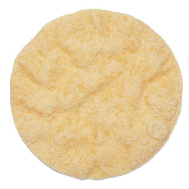 istock One poppadom isolated on white background shot from above 1163008994