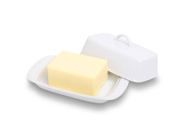 istock Block of butter in white ceramic butter dish isolated on white with path 1163008998