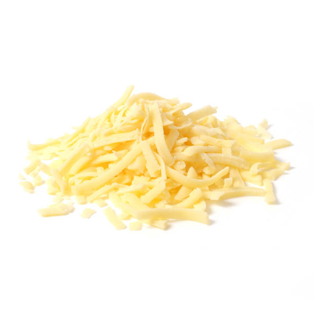 istock Pile of grated cheddar cheese isolated on white background 1163009002