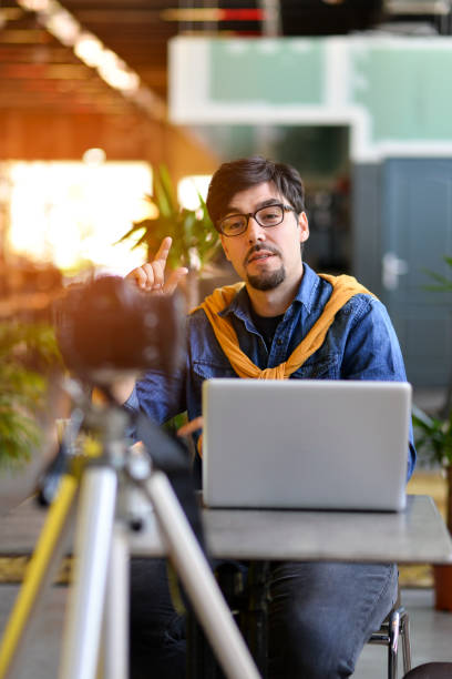 istock Young man making a video blog 1163009035
