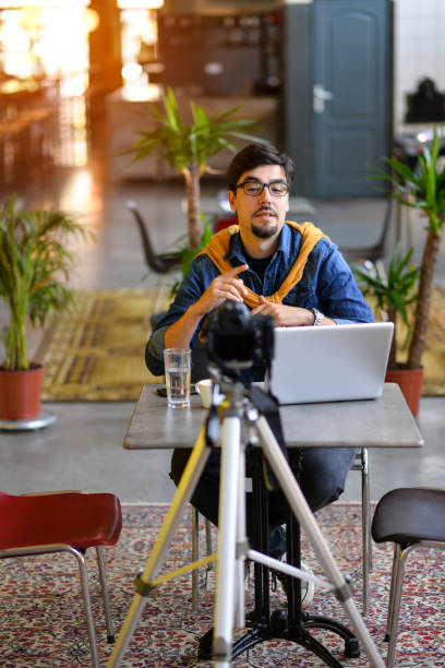 istock Young man making a video blog 1163009170
