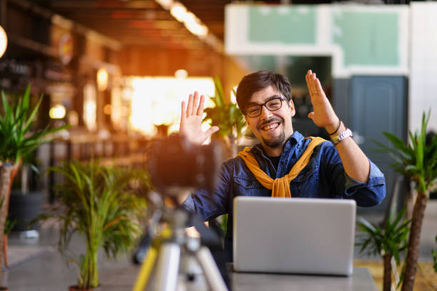 istock Young man making a video blog, you will have a growth in this work 1163009281