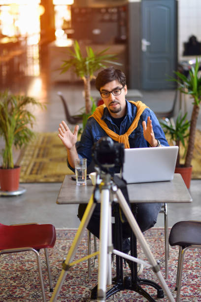 Young man making a video blog, you will have a growth in this work