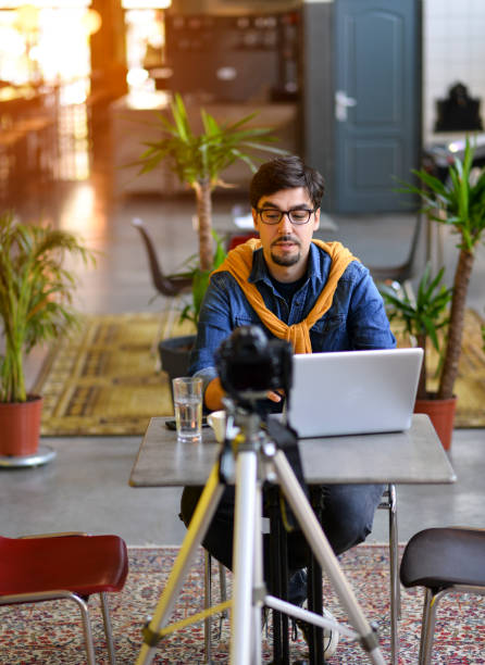 istock Young man making a video blog, you will have a growth in this work 1163009328