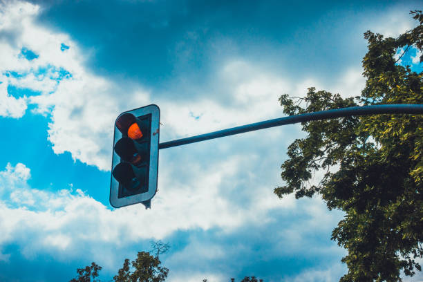 istock traffic light with color red and dramatic sky 1163010025