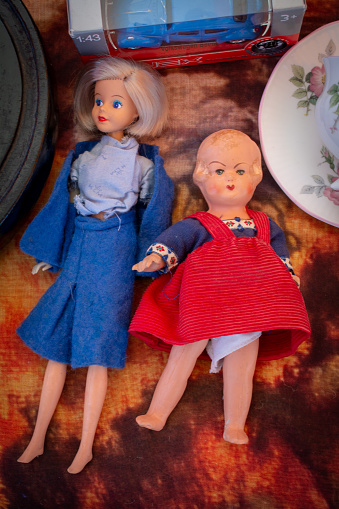 Second hand dolls, left one is collecteurs item, a KLM royal dutch airline stewardess first class gift doll On montmartre flea market in Gouda, Netherlands