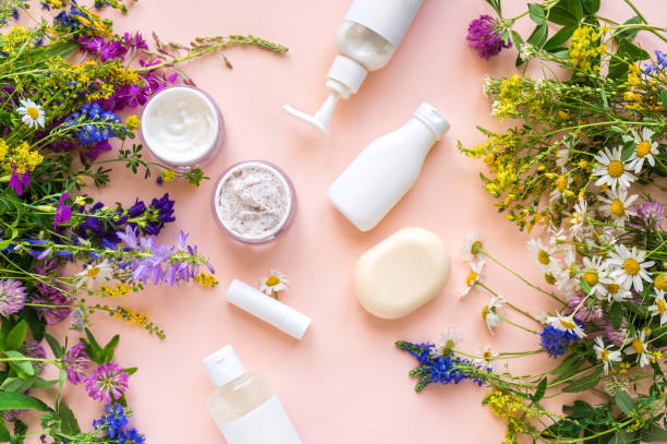 Natural cosmetics Eco friendly skincare. Natural cosmetics and organic herbs and flowers on pink background, top view, flat lay. Bio research and healthy lifestyle concept. grooming product photos stock pictures, royalty-free photos & images