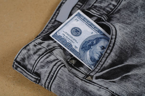 istock Banknote split out of a jean pocket . 1163013420