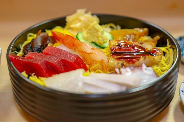 donburi chirashi-sushi - sashimi white prepared fish hamachi foto e immagini stock