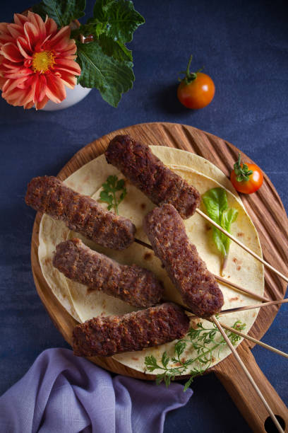 istock Lamb kebabs with pita bread, vegetables and yogurt sauce 1163019405