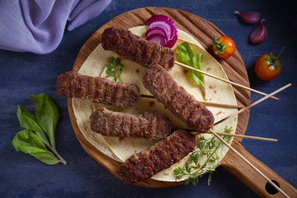 istock Lamb kebabs with pita bread, vegetables and yogurt sauce 1163020046
