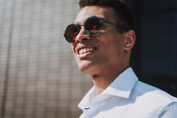 istock Happy elegant man in modern shades outside 1163022160