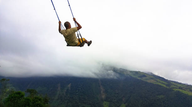 the swing at the end of the world located at casa del arbol, the tree house in banos, équateur - birds eye chilli photos et images de collection