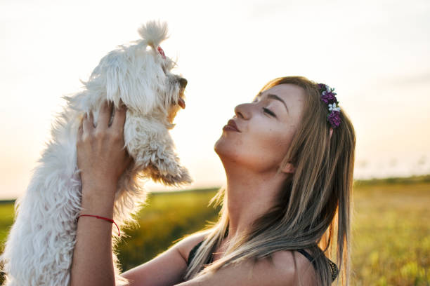 istock Young woman with dog 1163022555
