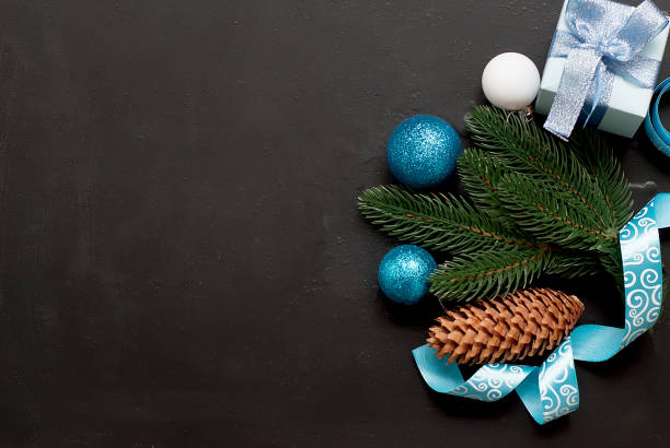 istock Christmas background with blue balls and fir branches 1163023729