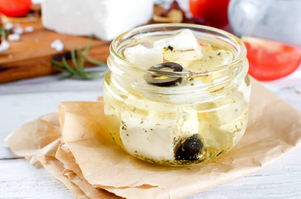 istock Marinated feta cheese in olive oil in jar 1163024554