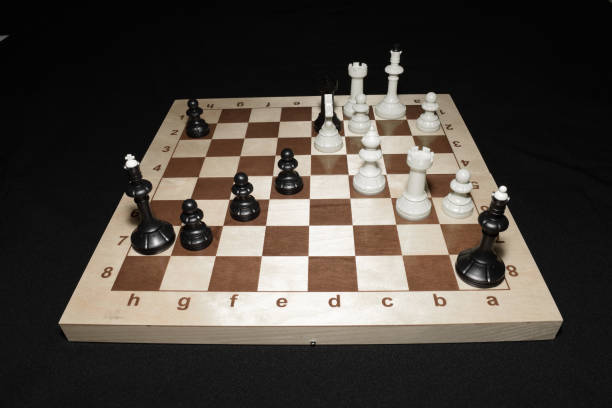 istock Wooden chessboard and black pieces for skill background 1163024778