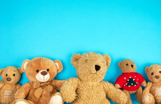 istock teddy bears on a blue background, friendship concept, 1163025371
