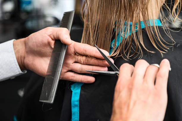 istock Mature woman getting her hair cut 1163028419