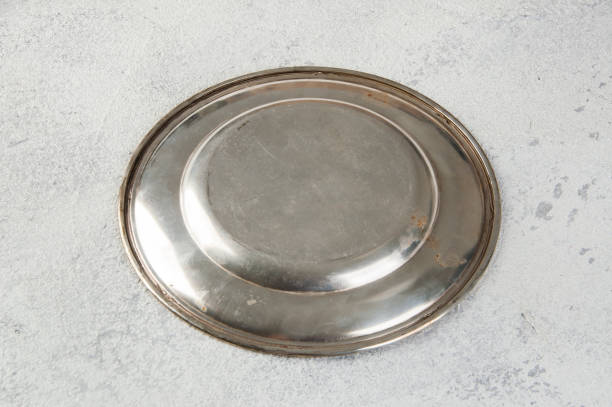 istock Vintage metal plate on concrete background. 1163029003