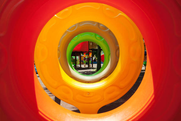 Part of colorful plastic wheels for wriggling, details of park playground for kids.