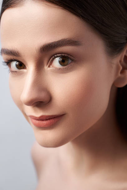 istock young lady with perfect skin against light gray background 1163032606