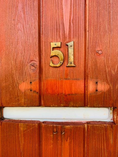 istock House number 51 on a wooden wall 1163033567