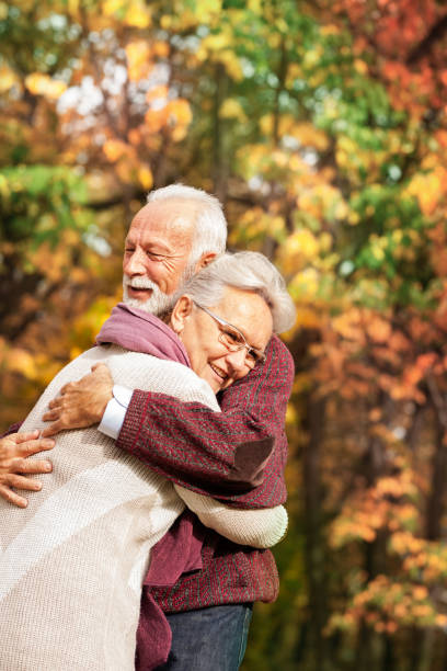 istock Senior couple in autumn landscape 1163034886