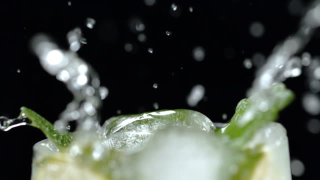 SLO MO Adding ice to a cocktail
