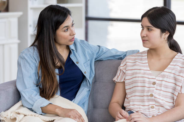 istock Mid adult mom has important conversation with daughter 1163038244