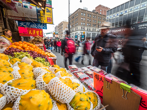 New York City, USA - May 01, 2019: Street market with exotic fruits at one of the streets of Flushing, Queens - NYC’s hub of economic development, spurred by immigration from Southeast Asia.