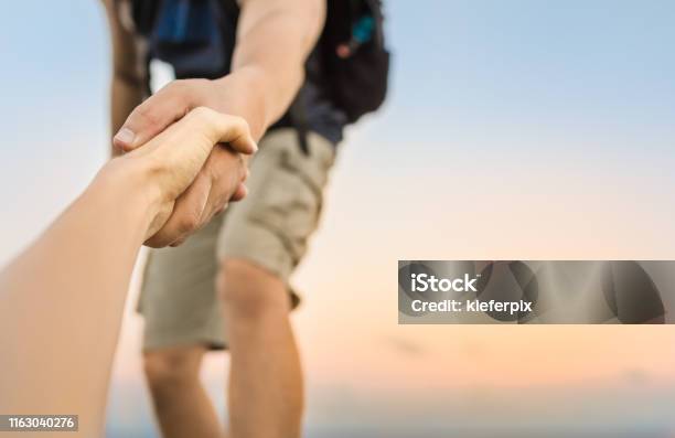 Giving A Helping Hand Stock Photo - Download Image Now - A Helping Hand, Assistance, Trust