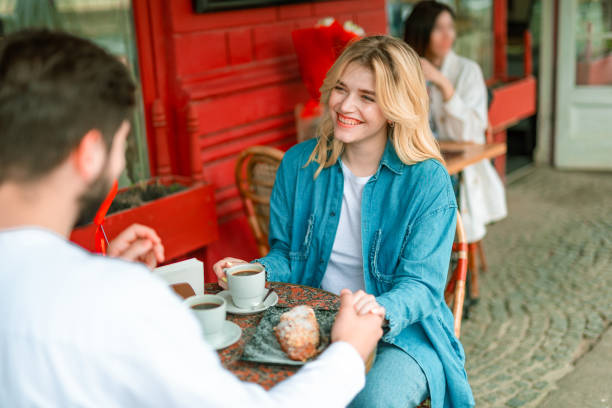 istock Joyful bearded man holding hand of his charming girlfriend 1163040442