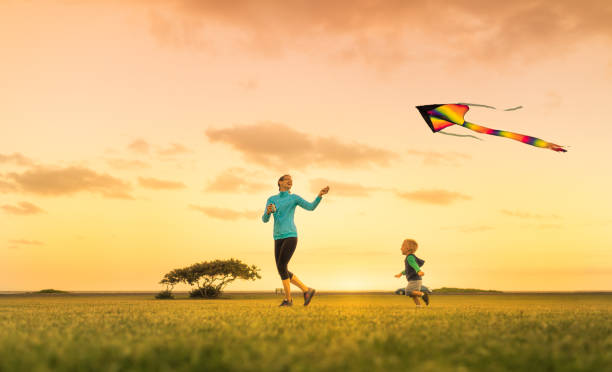 istock Mother and son flying a kite 1163040471