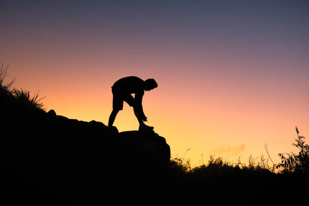 istock Male hiker tying his shoelace 1163040520
