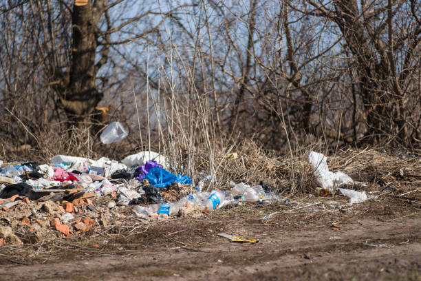 istock Trash on the agriculture field. Ecology problem and big harm to nature. 1163041789